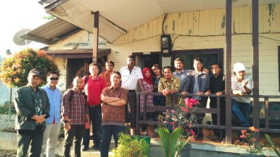 Taking a moment for a photo after a site visit with suppliers in Aceh