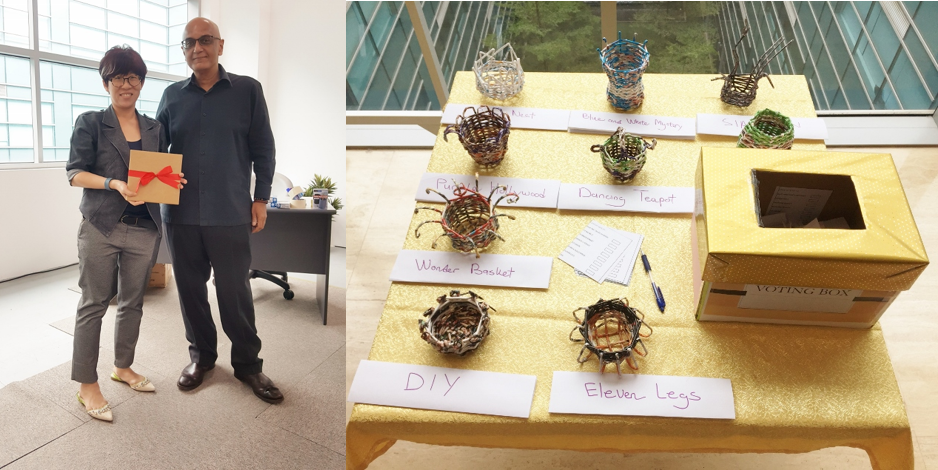 May Ng, System Enhancement receiving a gift from Hemant Bhatt, DS CEO. Her handmade-paper craft was voted one of the best by employees –