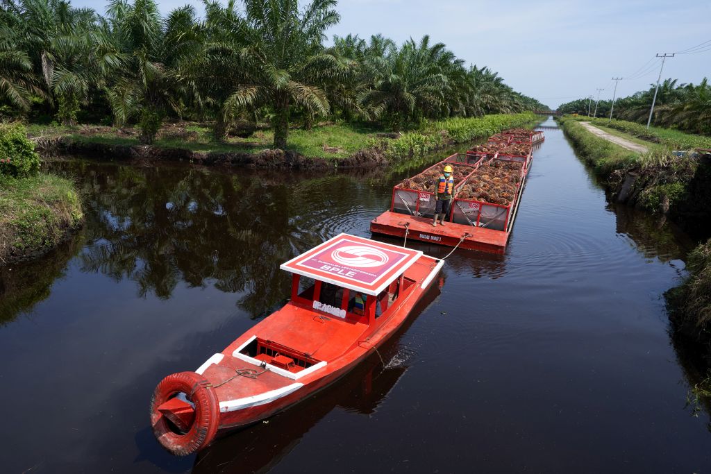 A-barge-being-towed-by-a-tugboat-pon-pon